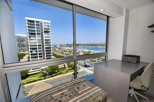 a view of swimming pool outdoor seating and city view