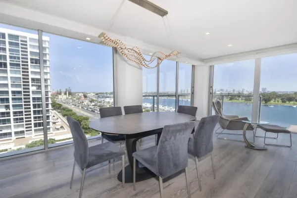 a view of a dining room with furniture and wooden floor