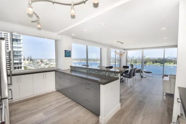 a kitchen with lots of counter top space and dining table