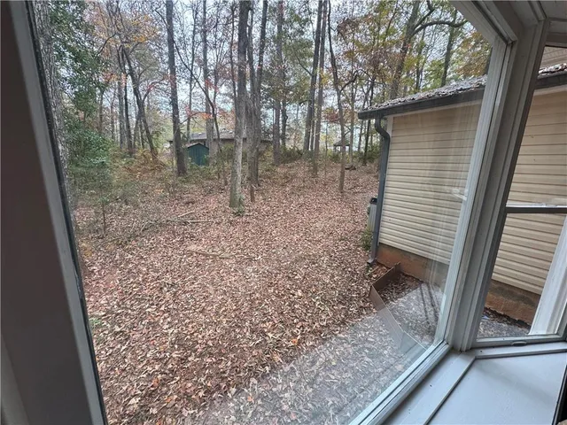 a view of a roof deck with wooden floor and fence