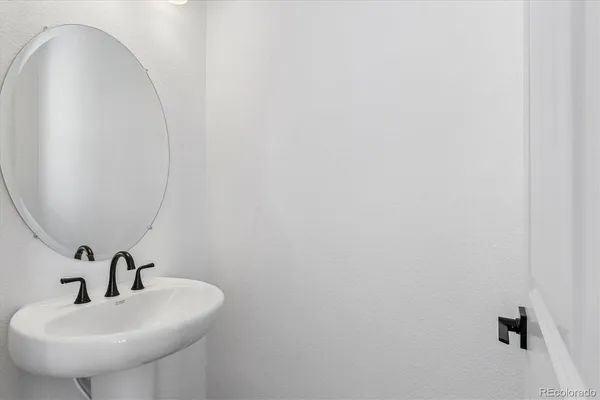 a bathroom with a sink and mirror