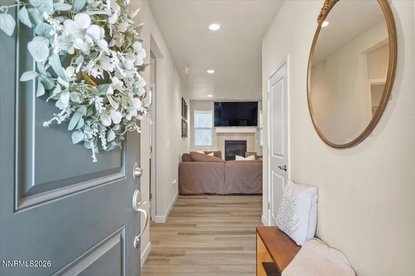 a living room with a fireplace and a flat screen tv