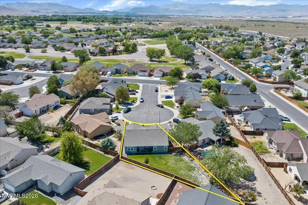an aerial view of residential houses with outdoor space