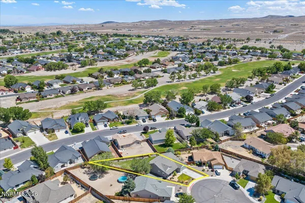 an aerial view of city and ocean