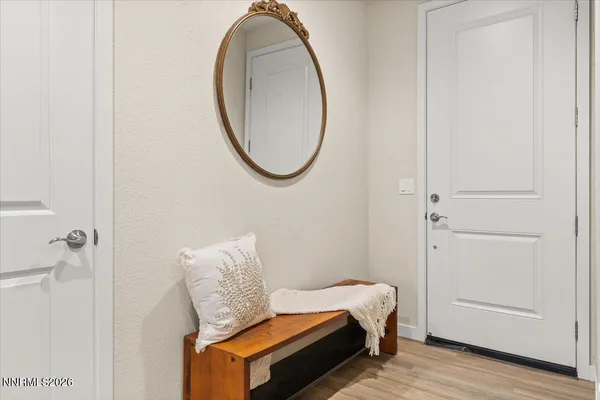 a room with a bed and a mirror