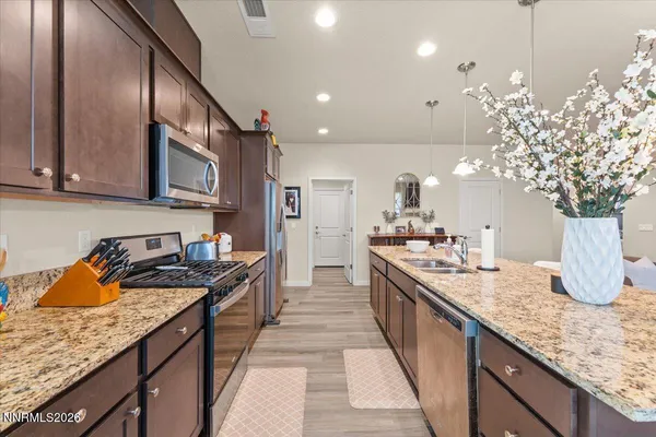 a kitchen with granite countertop lots of counter top space