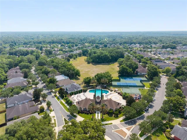 an aerial view of a house with a lake view