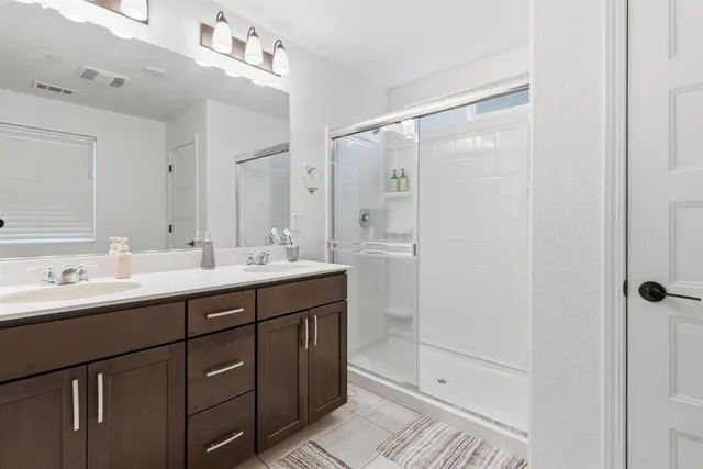 a bed room with a bed and a window