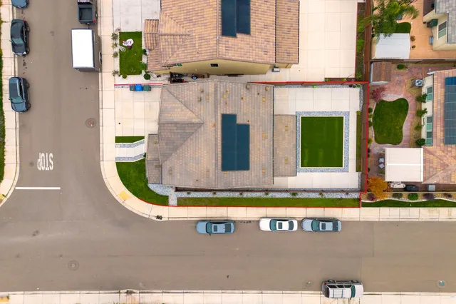 an aerial view of a house with a swimming pool
