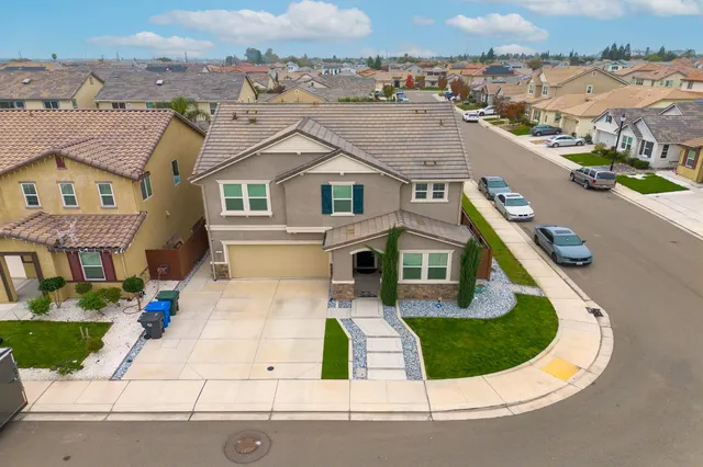 an aerial view of a house with a swimming pool