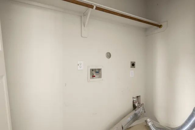 a bathroom with a shower and toilet