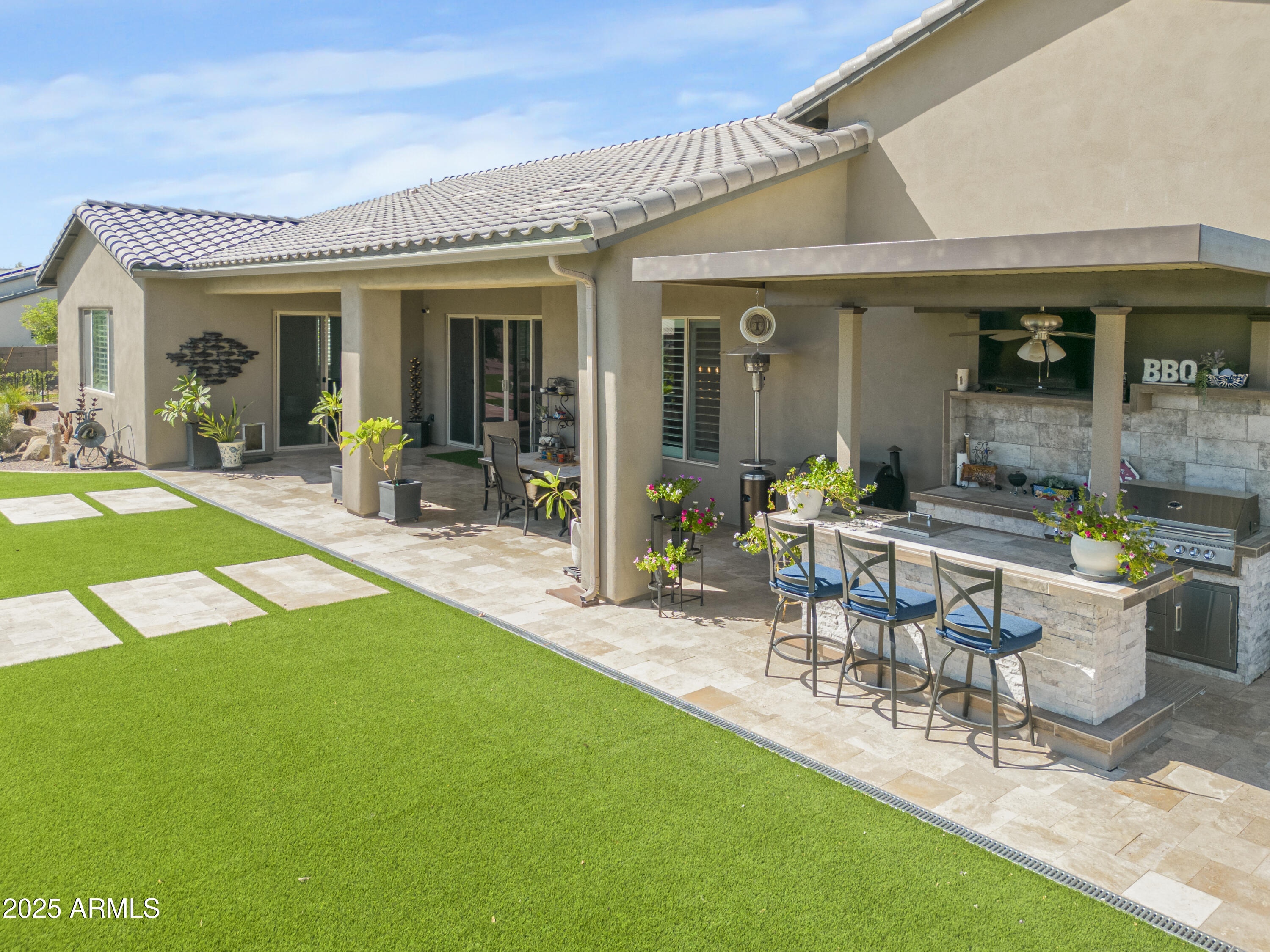 1011 West Carlise Road Phoenix, AZ 85086 - Photo 16 of 33 a view of a house with a backyard patio and swimming pool