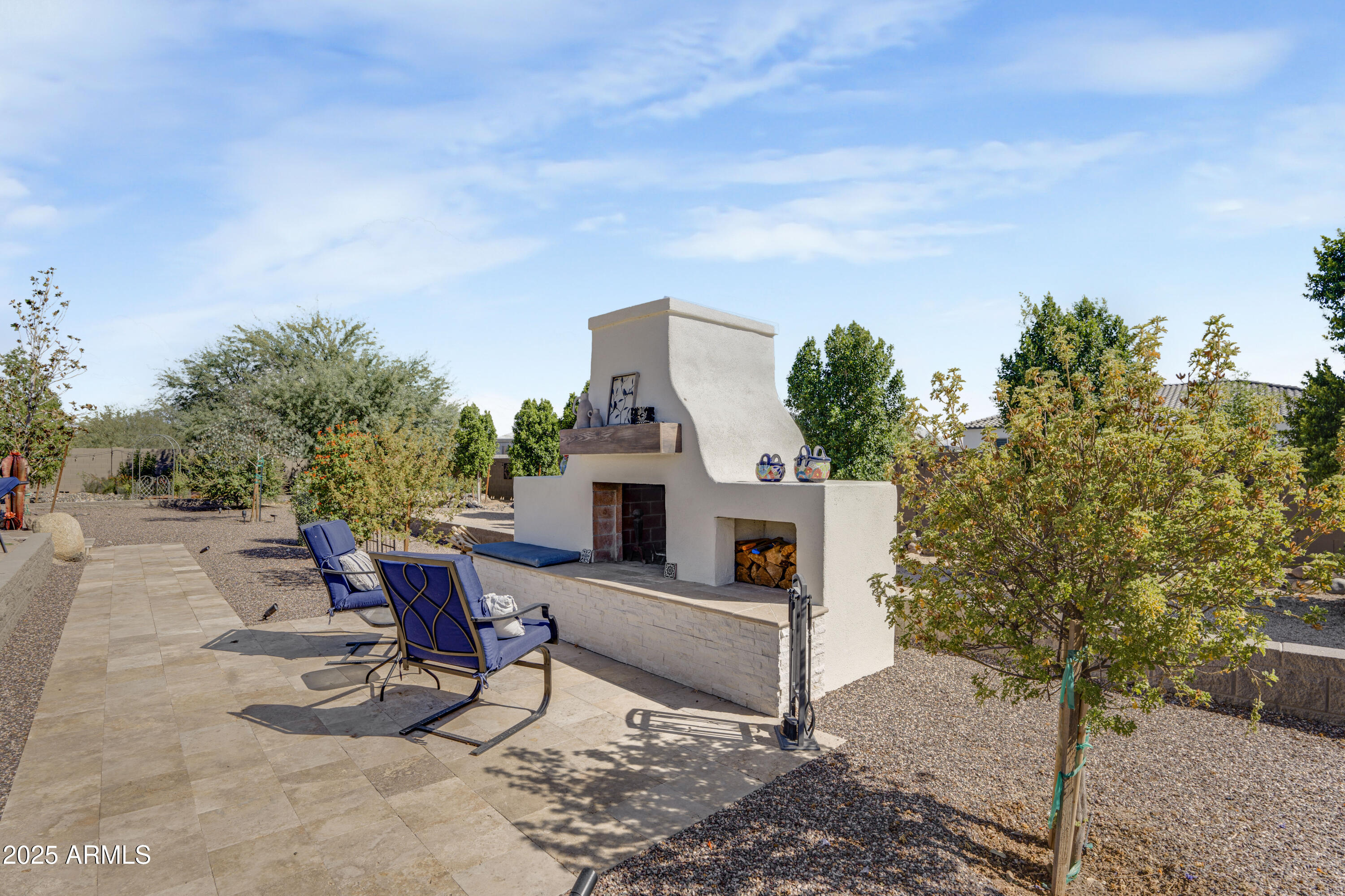 1011 West Carlise Road Phoenix, AZ 85086 - Photo 17 of 33 a view of a chairs and table in the backyard