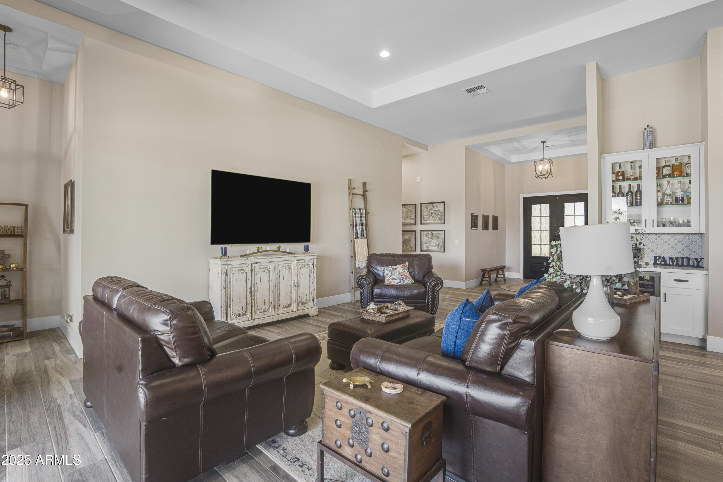 1011 West Carlise Road Phoenix, AZ 85086 - Photo 2 of 33 a living room with furniture and a flat screen tv