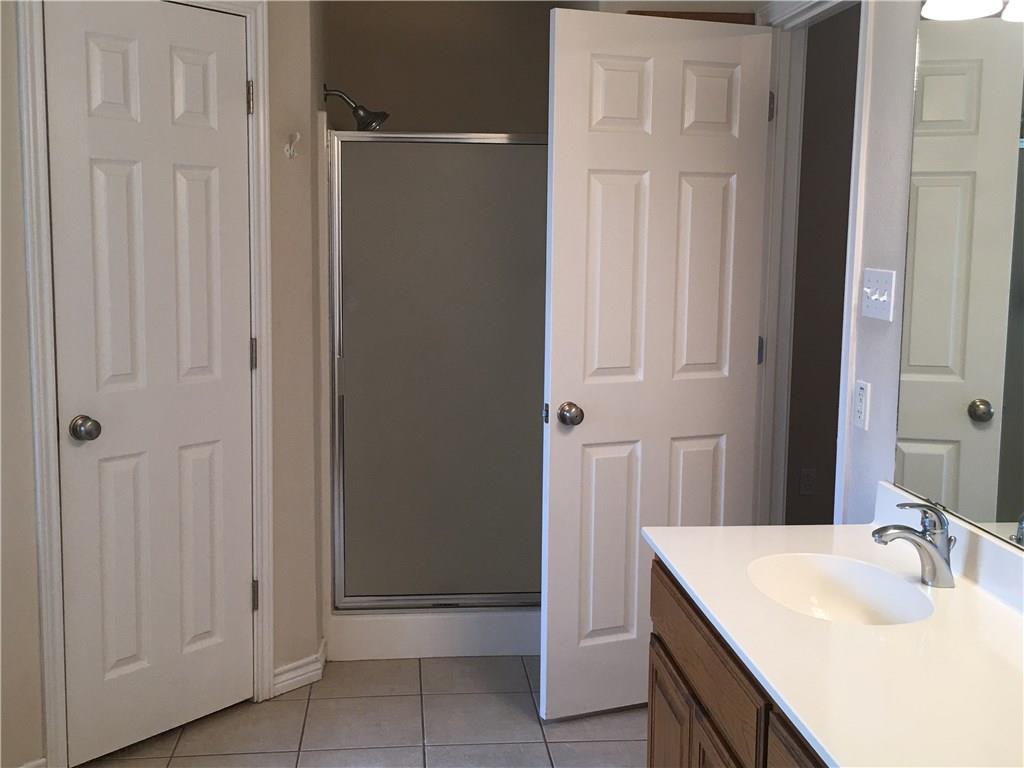 2218 Old Ironsides Road Abilene, TX 79601 - Photo 22 of 26 a bathroom with a sink and a mirror