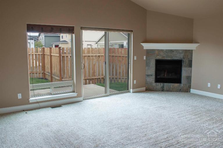 61723 Rigel Way Bend, OR 97702 - Photo 6 of 17 a view of a room with an empty room and floor to ceiling window