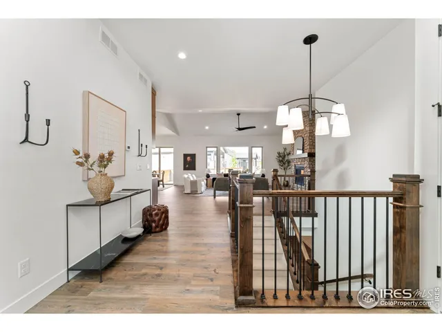 a living room with furniture a fireplace and a window