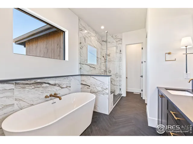 a bathroom with a sink a potted plant and a mirror