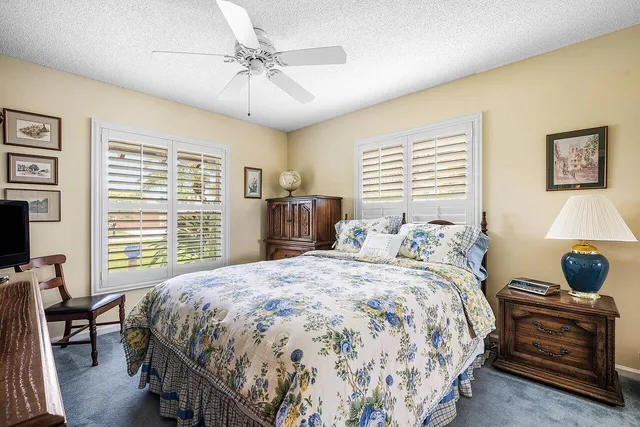 a bedroom with a bed and a table