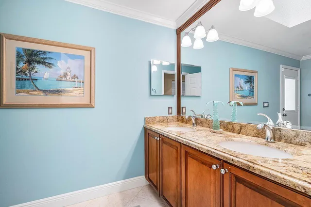 a bathroom with a granite countertop sink mirror and a
