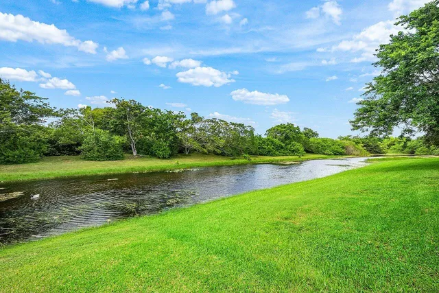a view of a lake with a big yard