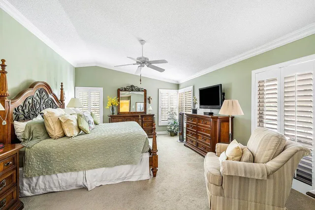 a bedroom with furniture and a flat screen tv