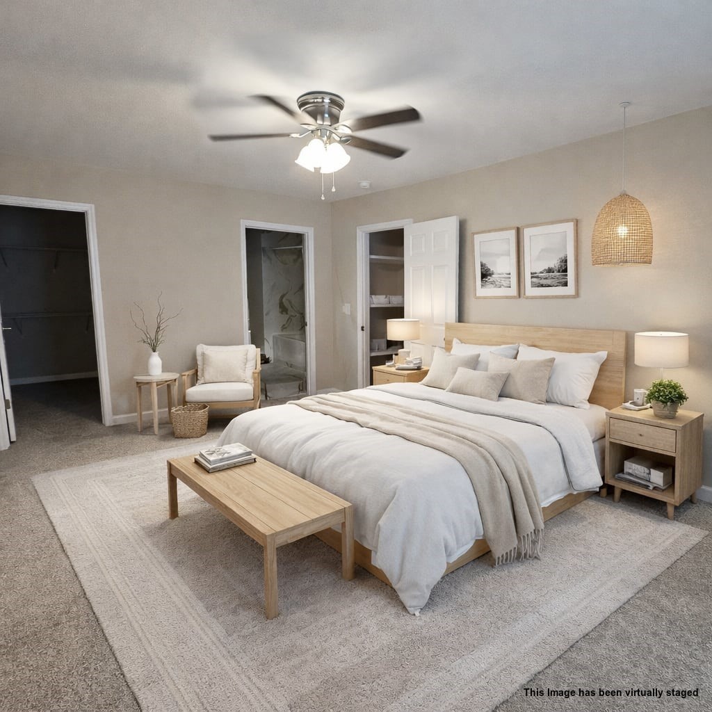 107 Gentry Street Tullahoma, TN 37388 - Photo 19 of 34 a bedroom with a bed and lamp