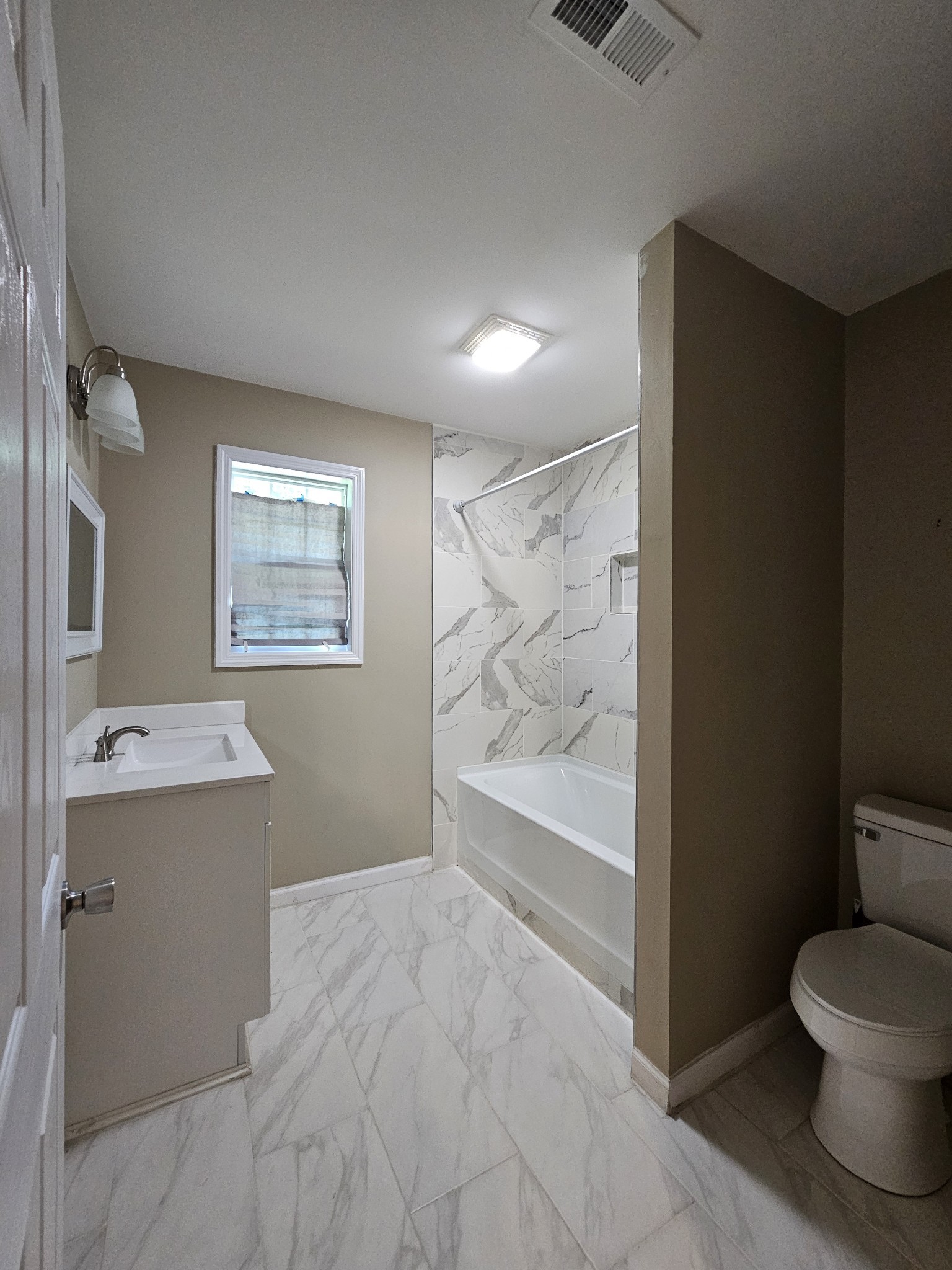 107 Gentry Street Tullahoma, TN 37388 - Photo 24 of 34 a bathroom with a toilet sink and mirror