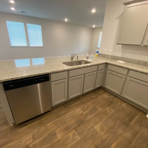 a view of an empty room with closet area