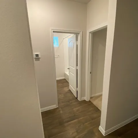 a bathroom with a sink mirror vanity and toilet