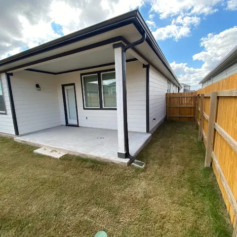 a view of backyard with garage
