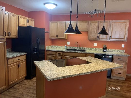 1004 South Farragut Street Ridgecrest, CA 93555 - Photo 5 of 13 a kitchen with stainless steel appliances granite countertop a sink a stove and a refrigerator