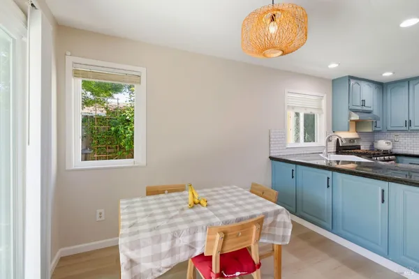 a kitchen with a sink cabinets and window
