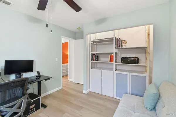 a workspace with furniture and window