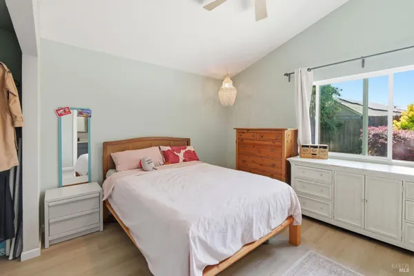 a bedroom with a bed and a dresser