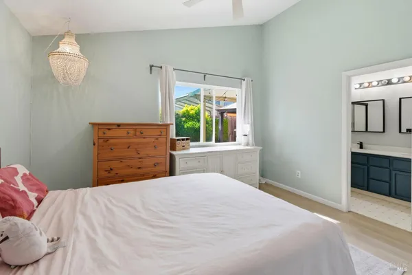 a bedroom with a bed and a dresser