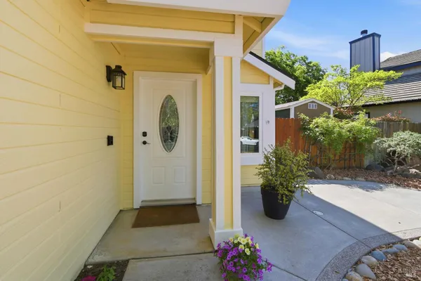 a front view of a house with a garden
