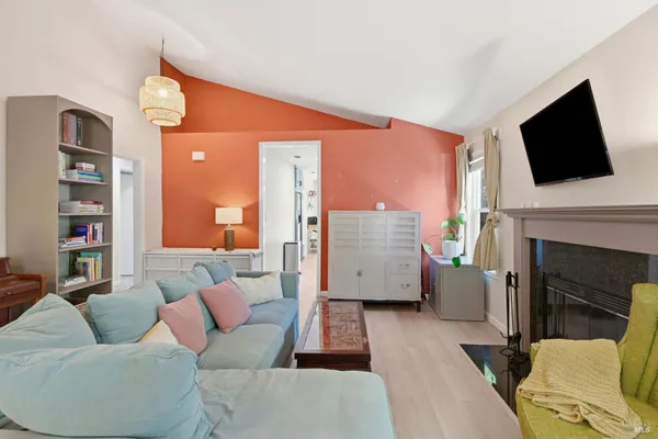 a living room with furniture and a flat screen tv
