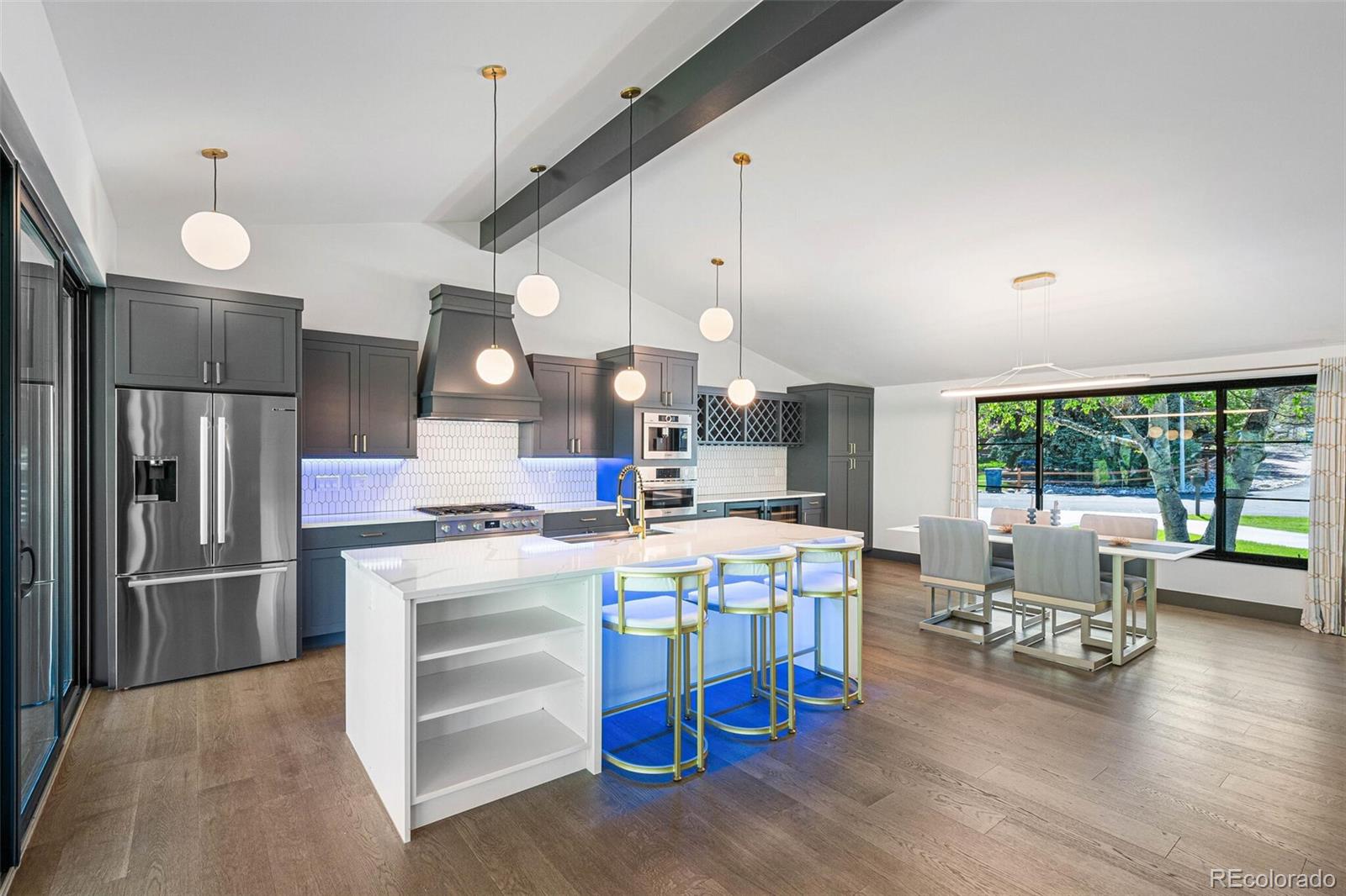 17 Rangeview Drive Wheat Ridge, CO 80215 - Photo 12 of 50 a large kitchen with a table and chairs