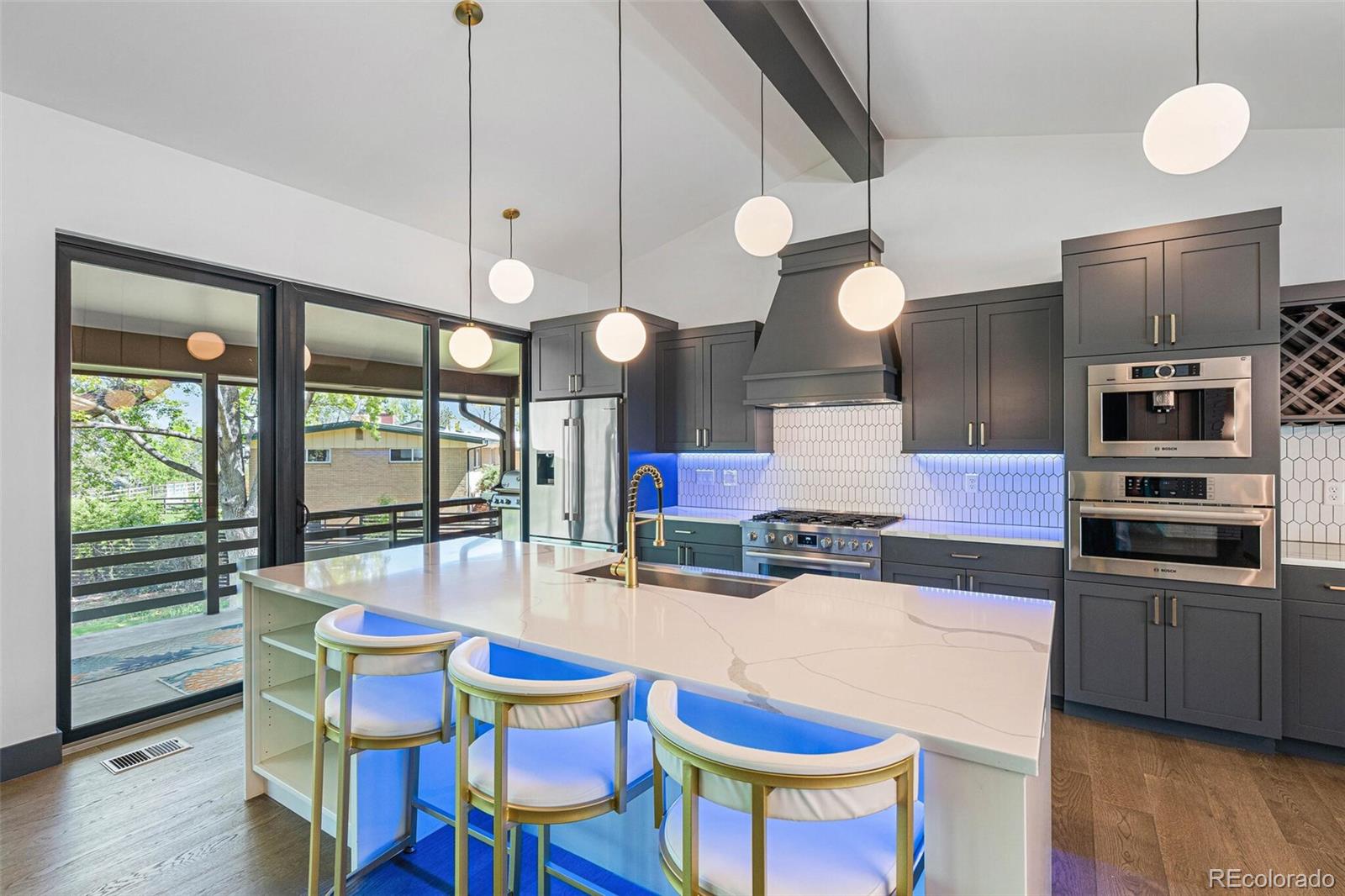 17 Rangeview Drive Wheat Ridge, CO 80215 - Photo 13 of 50 a kitchen with a table and chairs in it