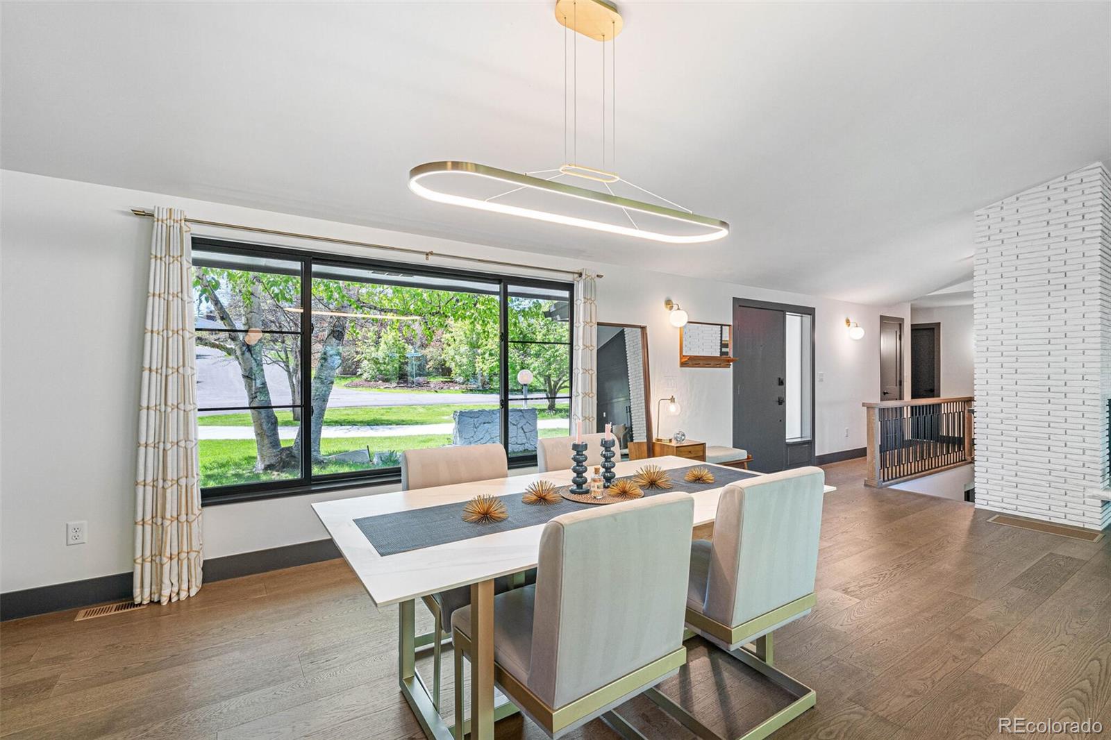 17 Rangeview Drive Wheat Ridge, CO 80215 - Photo 17 of 50 a dining room with furniture window and wooden floor