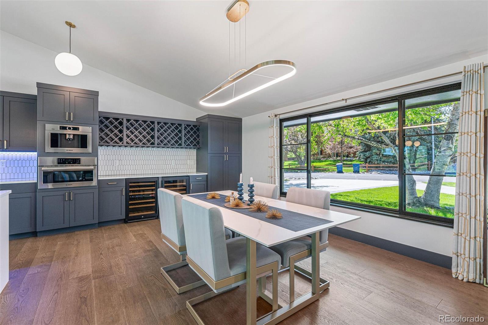 17 Rangeview Drive Wheat Ridge, CO 80215 - Photo 18 of 50 a kitchen with a stove a sink and a microwave
