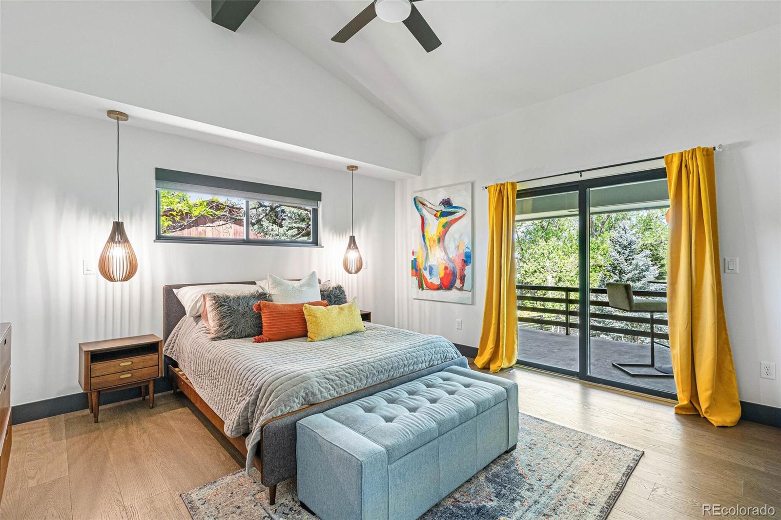 17 Rangeview Drive Wheat Ridge, CO 80215 - Photo 21 of 50 a bedroom with a bed and a dresser next to a window
