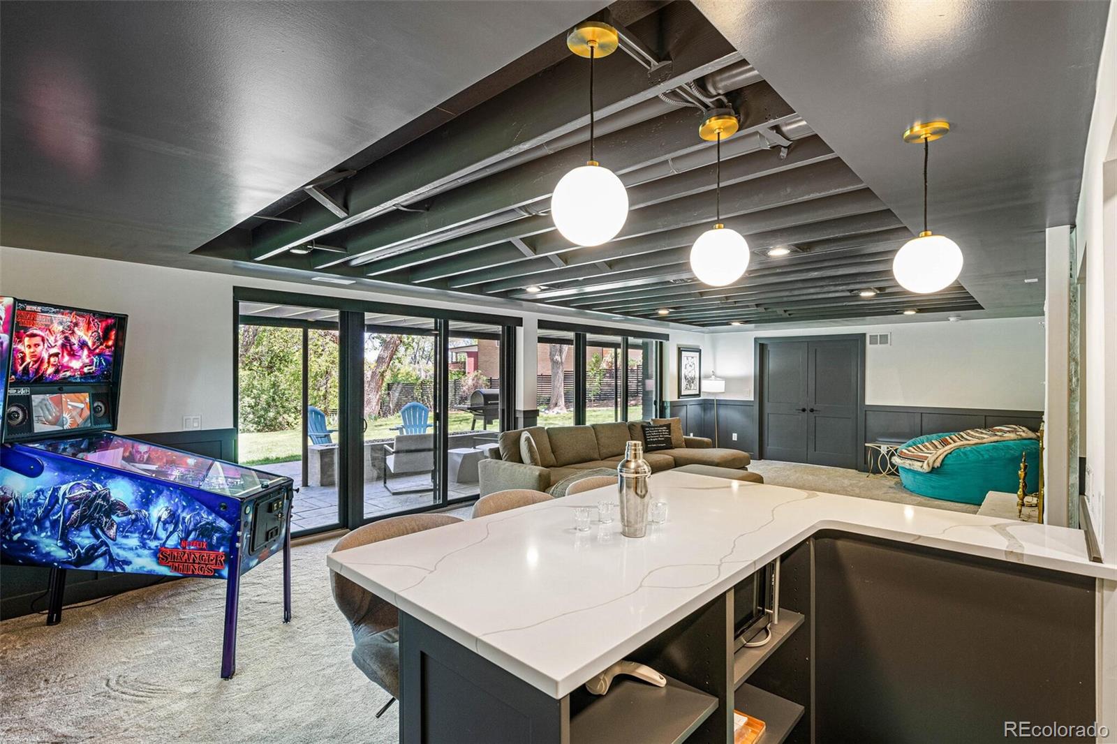 17 Rangeview Drive Wheat Ridge, CO 80215 - Photo 29 of 50 a view of a dining room with furniture and a chandelier