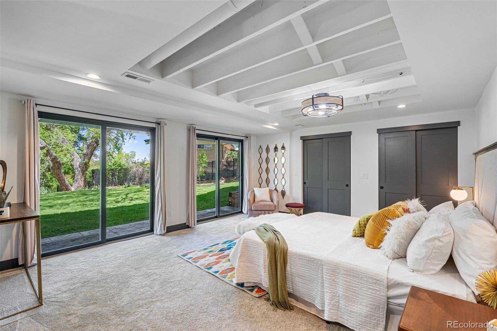 17 Rangeview Drive Wheat Ridge, CO 80215 - Photo 32 of 50 a bedroom with bed and a large window