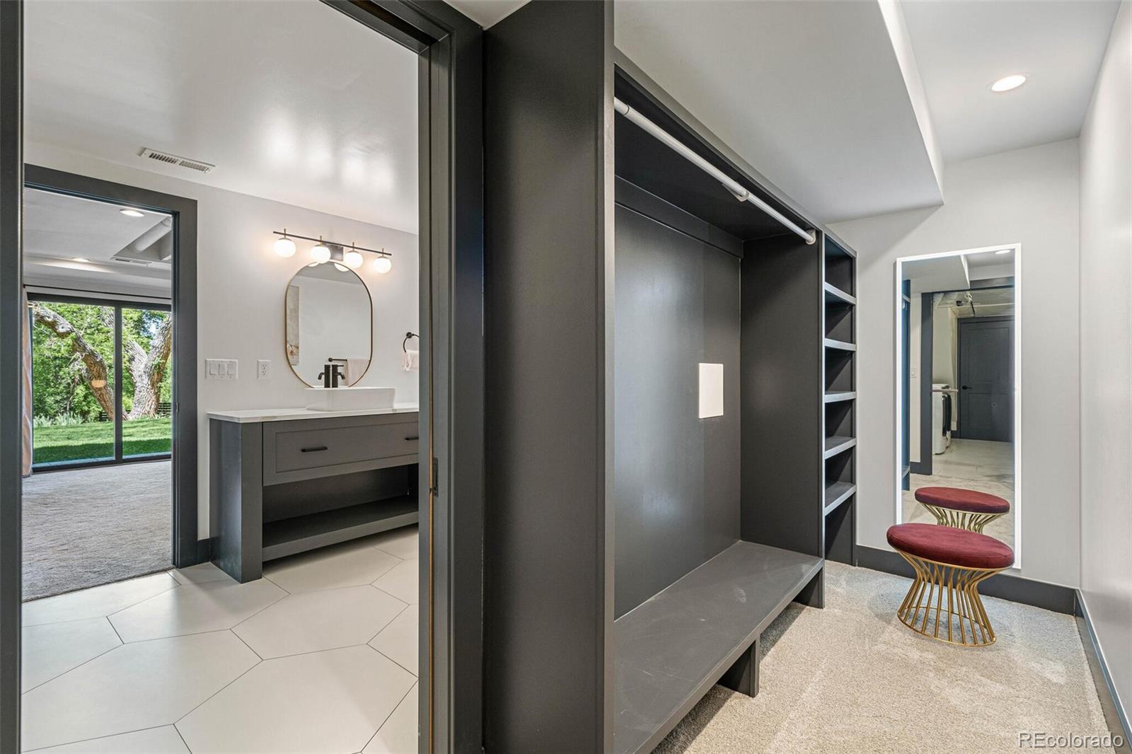 17 Rangeview Drive Wheat Ridge, CO 80215 - Photo 37 of 50 a en suite bathroom with a toilet sink and mirror