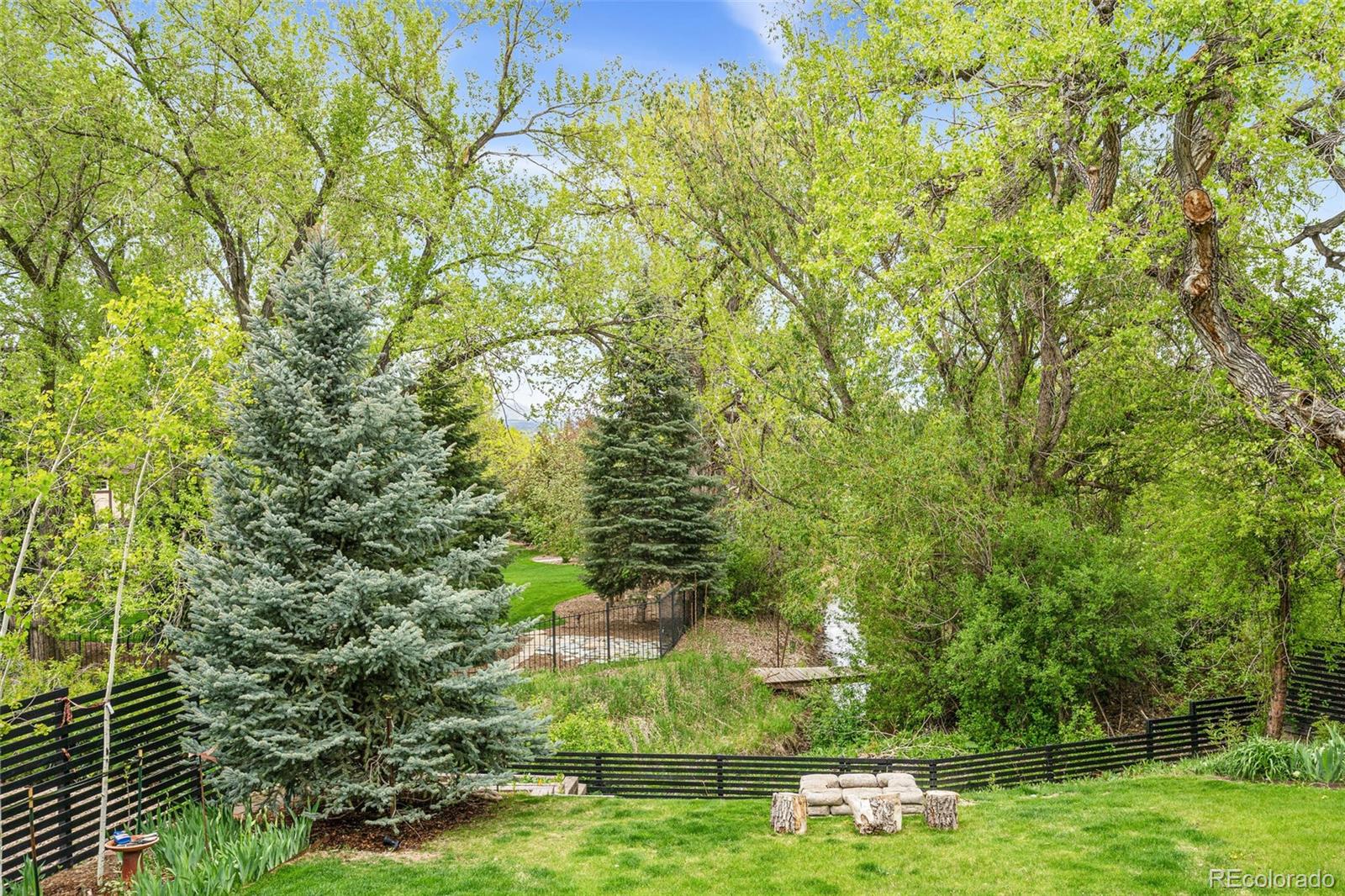 17 Rangeview Drive Wheat Ridge, CO 80215 - Photo 43 of 50 a view of a garden with large trees