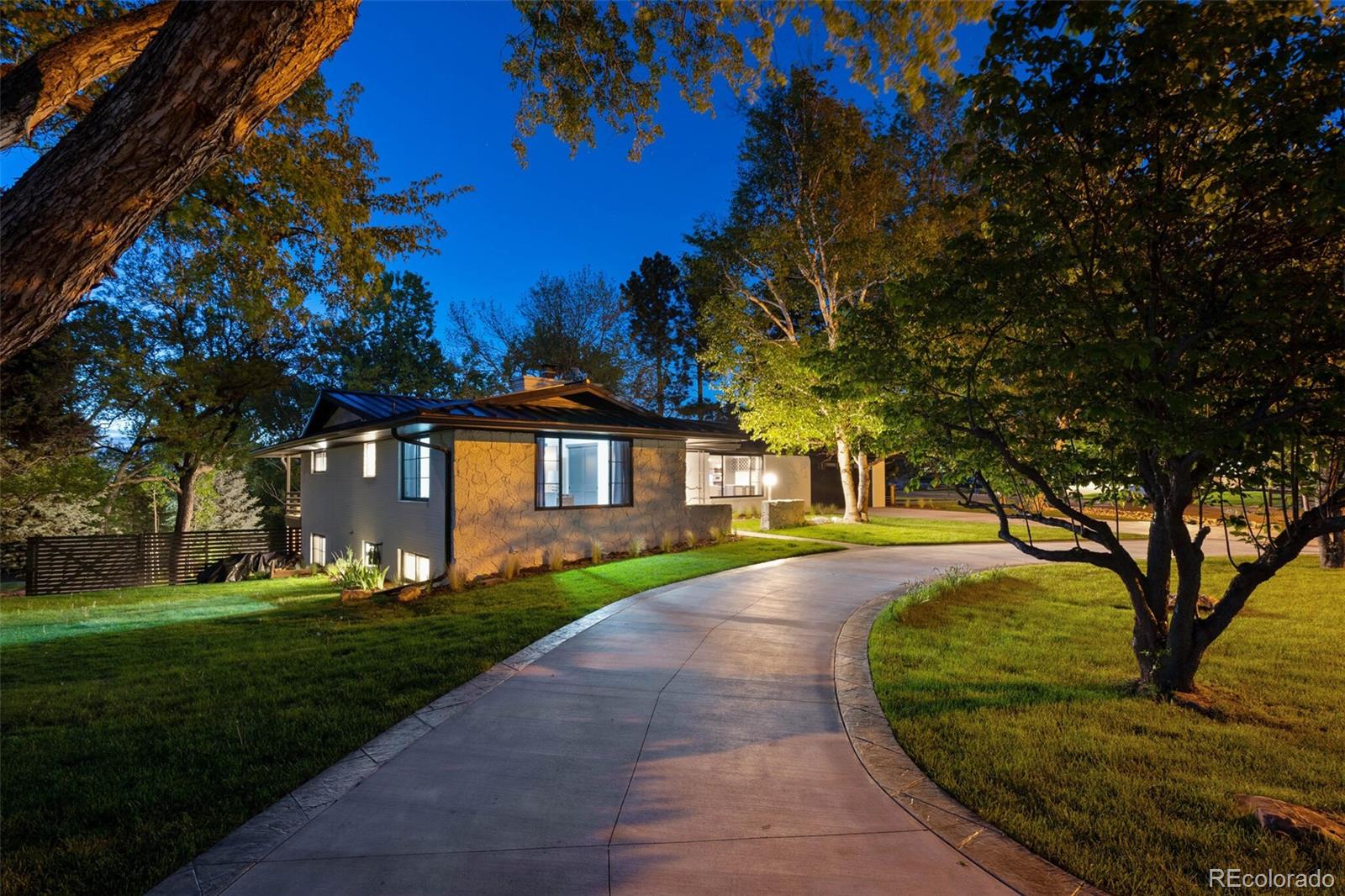 17 Rangeview Drive Wheat Ridge, CO 80215 - Photo 50 of 50 a front view of a house with a yard and trees