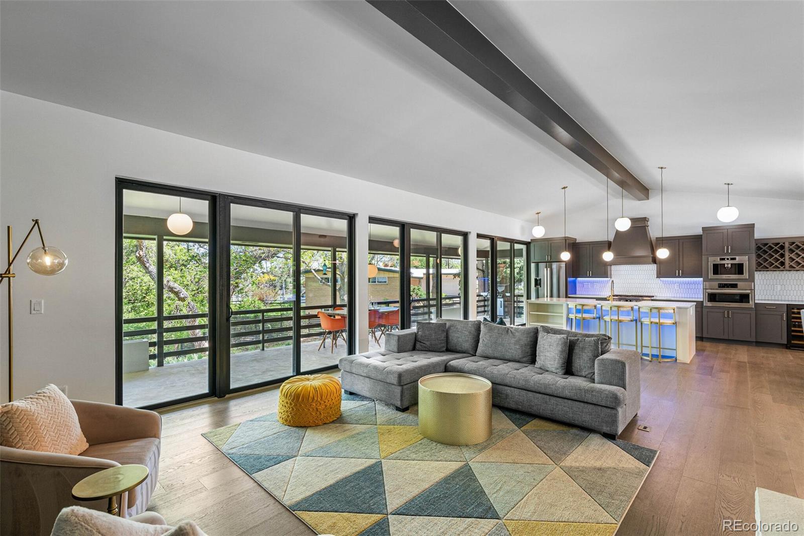 17 Rangeview Drive Wheat Ridge, CO 80215 - Photo 6 of 50 a living room with furniture and a large window
