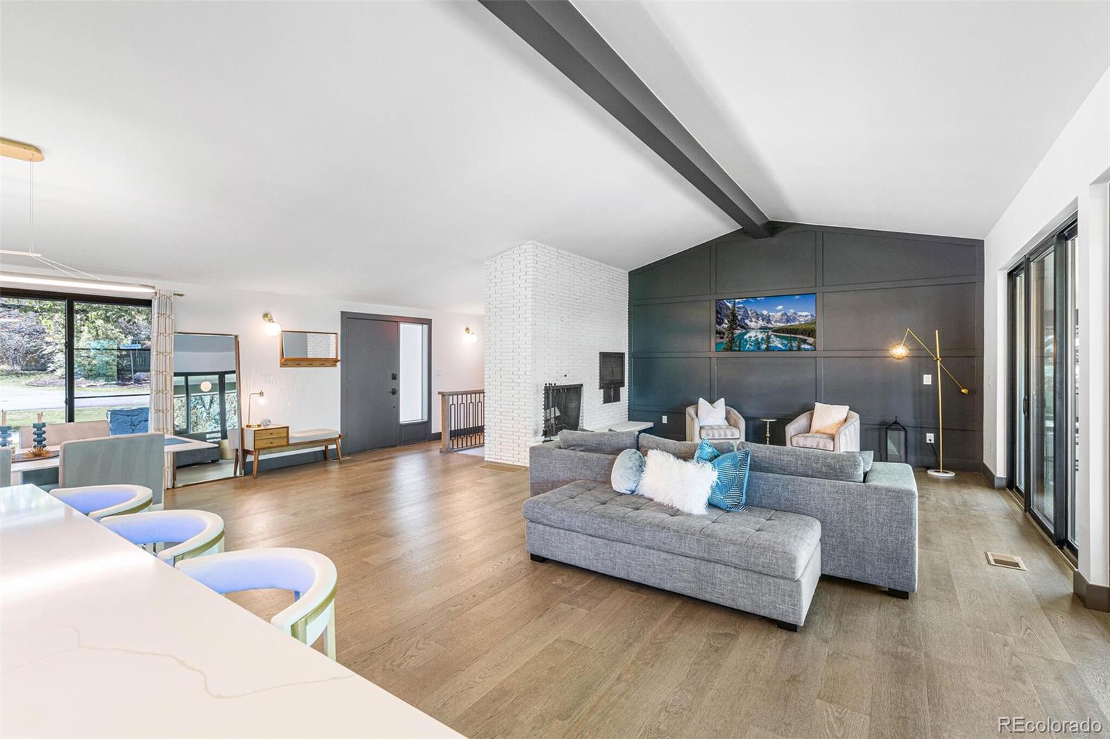 17 Rangeview Drive Wheat Ridge, CO 80215 - Photo 9 of 50 a living room with furniture and a table